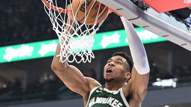 Milwaukee Bucks forward Giannis Antetokounmpo (34) dunks the ball in the first half at Fiserv Forum.